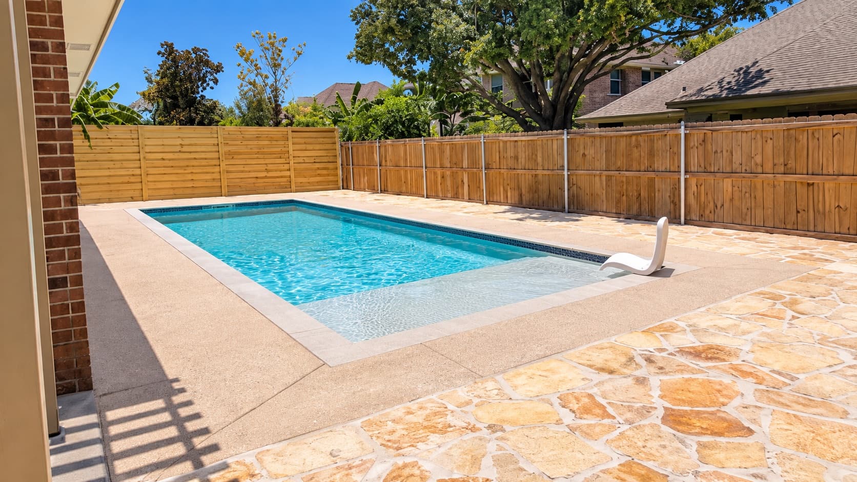 Finished backyard pool, deck and flagstone patio built by Southern Gardens in the Rio Grande Valley